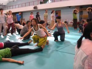 people in the studio stretching on mats